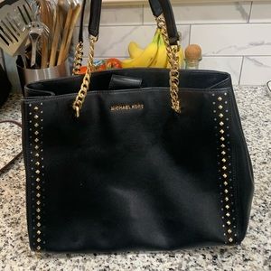 Unique Michael kors black bag with gold